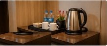 In-room tea and coffee amenities on hospitality desk